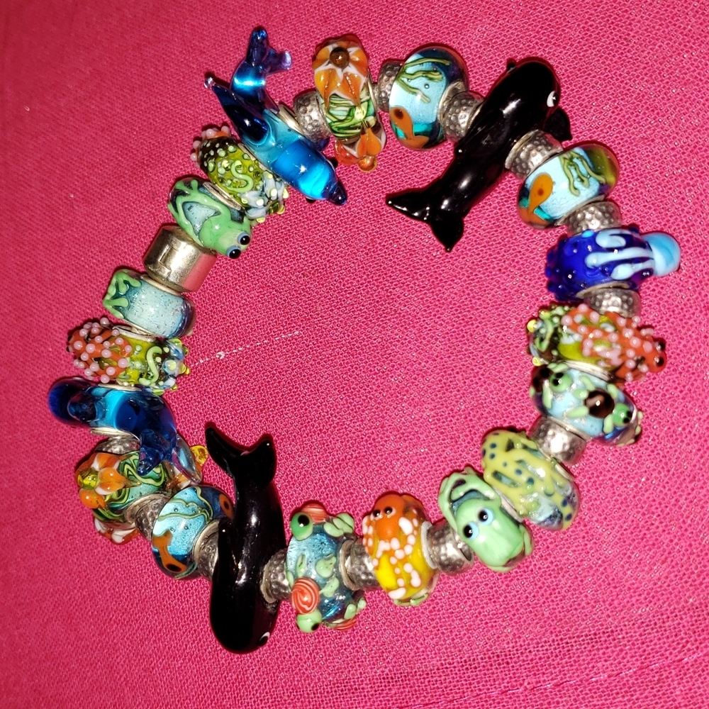 Sterling silver bracelet with handmade Moreno glass beads. Ocean themed.
